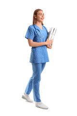 Wall Mural - Female nurse with folders on white background