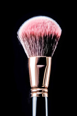 Makeup brush, on black background. Generative AI.