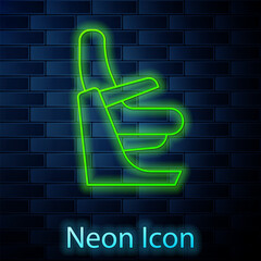 Sticker - Glowing neon line Airplane seat icon isolated on brick wall background. Vector