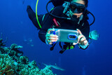 Fototapeta Do akwarium - Scuba Diver with iPhone Underwater Housing