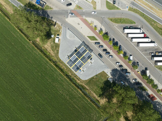 Top down view on a EV charging station along the highway.