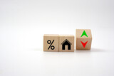 Fototapeta Mapy - House icon with percentage on wooden block and up and down of arrow. Interest rate finance, real estate and house loan concept.