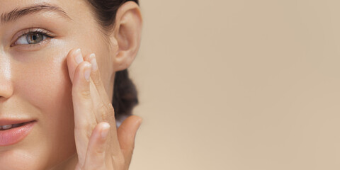 crop photo of cosmetics skin care concept photo of close-up woman perfect face with hydrated skin
