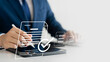 © Thapana_Studio - Elevate your business performance with online surveys, exams and evaluations, Watch as a professional businessman uses checklists to drive success and growth. Discover the power of assessment today