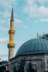 Wall Mural - Minaret of of Eyüp Sultan Mosque in evening time, Istanbul Turkey.