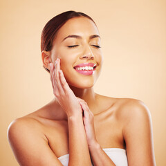 Canvas Print - Face, skincare touch and happy woman with eyes closed in studio isolated on a brown background. Beauty, cosmetics and natural model with spa facial treatment for aesthetic, wellness and healthy skin