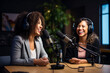 © Nataliia - Two young women record podcast and laugh. Generative AI content