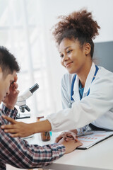 Wall Mural - You are now in a safe area. African american female doctor with patient, Wherever the art of Medicine is loved, there is also a love of Humanity.