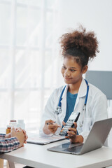 Wall Mural - You are now in a safe area. African american female doctor with patient, Wherever the art of Medicine is loved, there is also a love of Humanity.