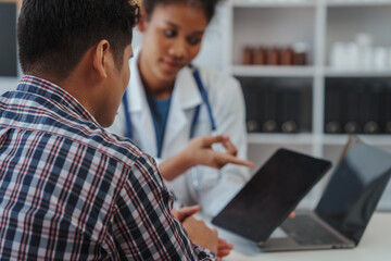 Wall Mural - You are now in a safe area. African american female doctor with patient, Wherever the art of Medicine is loved, there is also a love of Humanity.