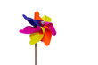 Colorful windmills on isolated white background in selective focus. Windmills with wings of different colors. Clean energy, LGBTQ colors concept.