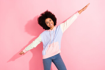 Wall Mural - Portrait of cheerful positive schoolchild beaming smile arms wings have good mood isolated on pink color background