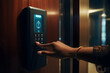 A person using a biometric scanner and unlocking their apartment door