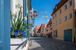 Colorful street with flowers in Rothenburg ob der Tauber in Germany.