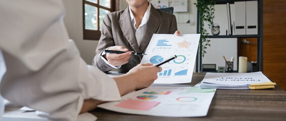 Wall Mural - Close up of Business team analyzing income charts and graphs with modern laptop computer. Business analysis and strategy concept