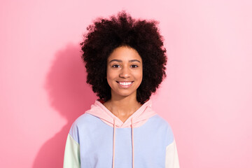 Poster - Portrait of positive cheerful person toothy beaming smile good mood colorful hoodie isolated on pink background