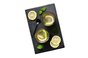 Wall Mural - Healthy breakfast or morning with chia seeds lemon and mint on table background, vegetarian food, diet and health concept. Chia pudding with lemon and mint