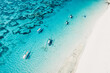 © artifirsov - Transparent ocean and beach with fishing boats in tropical island. Aerial view.
