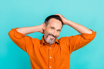 Sticker - Photo of optimistic handsome man with white gray beard wear stylish shirt arms on head touch hairdo isolated on teal color background