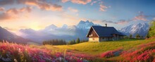 Scenic Sunrise In The Alp Mountains With Mountain Cottage In Background, Panorama.