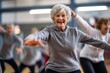 © aboutmomentsimages - Group of smiling senior people dancing while enjoying activities in retirement home - concept