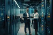 © pixardi - Man and woman use tablet to drive thriving IT infrastructure in data centre. Photo generative AI