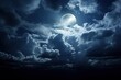 Bright full moon in the midnight dark blue sky surrounded by dramatic clouds