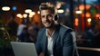 © Volodymyr Skurtul - A young businessman in a headset smilingly talks on a video call on a laptop. Sitting in the office at the table and holding a business meeting, training, greeting and waving at the camera. Generative