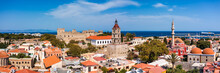 Panoramic View Of Rhodes Old Town On Rhodes Island, Greece. Rhodes Old Fortress Cityscape With Sea Port At Foreground. Travel Destinations In Rhodes, Greece.