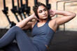 © Flamingo Images - Fit woman doing sit-ups in a gym