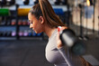 © Flamingo Images - Fit woman weight training at the gym