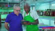 © Marco - African American senior employee using tablet device with colleague staff showing inventory with modern technology