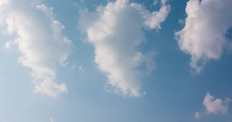 Wall Mural - Cloud blue sky background Time lapse Beautiful white clouds approach the point of view backed by a vivid blue sky in this one minute loop Time lapse raw photo interval at 1 second fade at video's end