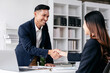 © Katcha - Business teamwork colleague concept, Business colleague shaking hands together after work successful about collaboration to brainstorming and discussing about strategy of new startup