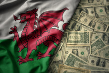 Colorful Waving National Flag Of Wales On A American Dollar Money Background. Finance Concept