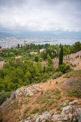 Wall Mural - Old ancient ruins of historic building, wall and a tree trunk in foreground. Part of Alanya castle, Turkey. 