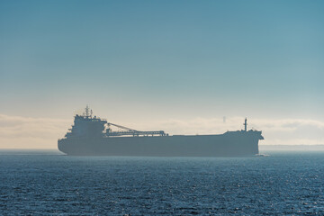 Large oil tanker departing San Francisco Bay in morning