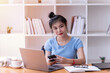 © nuwatphoto - Asian businesswomen used smartphone in the office.