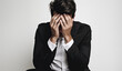 © ruang - man in suit, covering his face with his hands. Mental health concept
