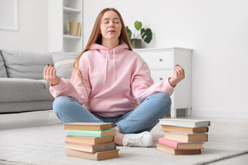 Poster - Teenage girl with books meditating at home