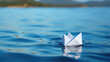 © rorozoa - With the bright summer sky above, the close-up highlights the enchanting allure of the simple paper boat gently sailing on the calm waters.