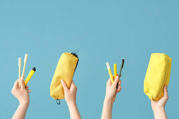 Female hands with school supplies on blue background