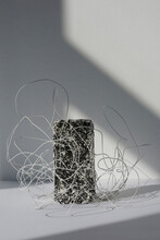 Abstract Installation Of Concrete Brick And Tangled Wire In Daylight Through Window