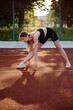 © rostyslav84 - Caucasian sports woman doing warming exrcises outdoors on the sports ground
