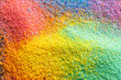 © vectorfusionart - Close up of multi coloured sand grains and copy space background