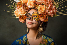 Portrait Of A Woman With Sugar Skull Makeup. Catrina With Butterfly Painted On Her Face. Halloween And Day Of The Dead Makeup.