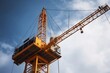 close-up of construction site crane, with its load suspended in the air