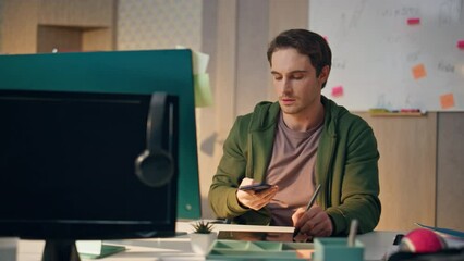 Wall Mural - Serious artist answering phone call workplace closeup. Designer drawing tablet