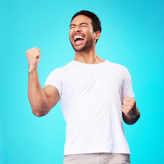 Poster - Happy asian man, winner and fist in studio for celebration, achievement and success on blue background. Excited model shout to celebrate winning prize, deal and victory of lottery, reward and bonus