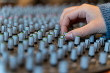 Macro Shot Of A Hand In A Control Panel Of A Music Recording Studio